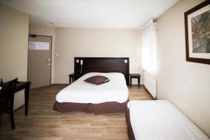 Postel nebo postele na pokoji v ubytování Ambiance Hotel