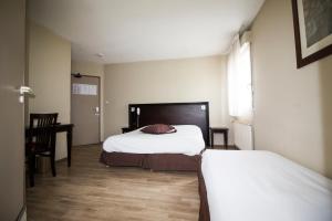 Postel nebo postele na pokoji v ubytování Ambiance Hotel