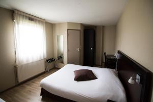 Postel nebo postele na pokoji v ubytování Ambiance Hotel