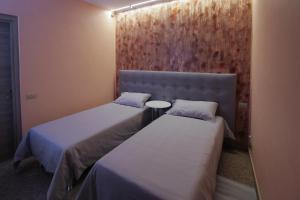 A bed or beds in a room at Villa Oldrado