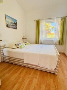 Postel nebo postele na pokoji v ubytování Kaštelina apartments