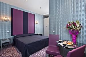 Łóżko lub łóżka w pokoju w obiekcie Hotel Relais Dei Papi