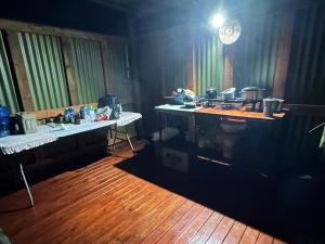 a room with two tables and a counter in a room at Nyati House in Khwai