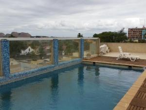 a view of a swimming pool on top of a building at Hotel Inter Chimoio in Chimoio