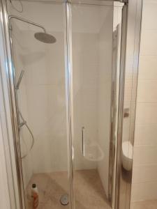 a shower stall in a bathroom with a toilet at Casa vacanza relax in Ortona +12 photos