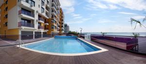 a swimming pool on the side of a building at Vila Sophia 1 Mamaia in Mamaia