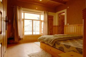 Postel nebo postele na pokoji v ubytování Mid Town Homestay + 17 fotografií