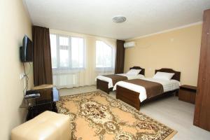 Rúm í herbergi á Nomad Hotel