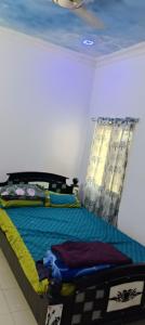 Ένα ή περισσότερα κρεβάτια σε δωμάτιο στο Paradise guest house