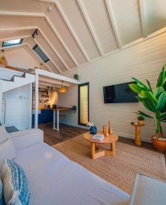 a living room with a couch and a table at Boheme Bungalow Sapanca in Sapanca +4 photos