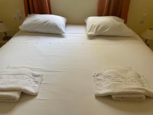 A bed or beds in a room at Cavo Plako Villas