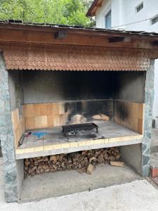 a brick oven with a fire inside of it at Royal Haven 