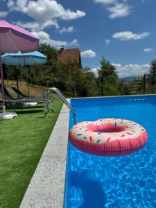 a large swimming pool with a red at Royal Haven 