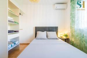Ένα ή περισσότερα κρεβάτια σε δωμάτιο στο ORCHIDEA, La Plage de Boucan Canot à vos pieds ! +4 φωτογραφίες