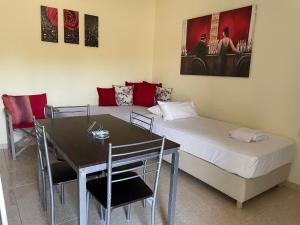 A bed or beds in a room at Cavo Plako Villas