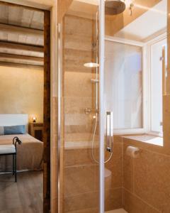 a shower with a glass door in a bedroom at La Contrà Valpolicella in Fumane +92 photos