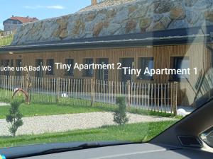 a building with a sign on the side of it at Timos Camp in Nöchling