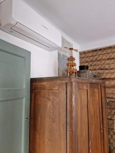 a kitchen with a wooden cabinet in a room at Hilltop view - 2 bedroom house with garden bbq - private parking - 12min to Uzupis anytime in Vilnius