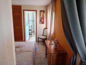 Postel nebo postele na pokoji v ubytování Tenerife Paradise Room 108