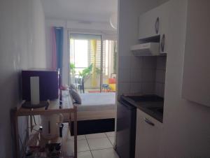 Kuchyň nebo kuchyňský kout v ubytování Studio Vanille - Vue Mer