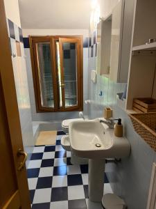 a bathroom with two toilets and a sink at B&B Emilia 330 Imola Centro Apartment in Imola +16 photos