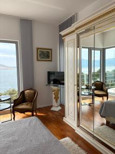 a bedroom with a view of the ocean at Shimmer & Shine in Baška