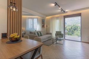 a living room with a couch and a table at D Star - New Luxury Apartment with Big Balcony Bay View in Risan