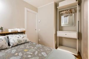 Postel nebo postele na pokoji v ubytování felino24parma - Il Borgo