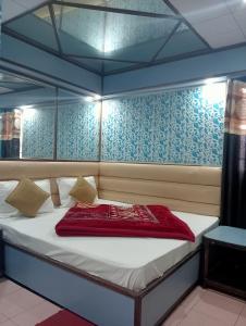 Ένα ή περισσότερα κρεβάτια σε δωμάτιο στο Hotel Relax