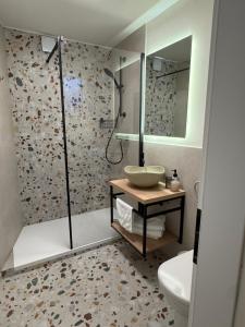 a bathroom with a sink and a shower at Ameli Heritage rooms & apartments in Zadar +44 photos