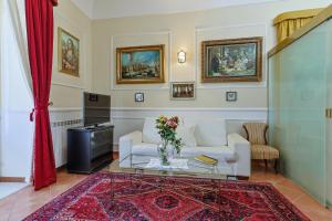 a living room with a couch and a table at La casa di Dante in Palermo