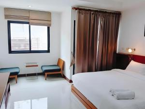 Ένα ή περισσότερα κρεβάτια σε δωμάτιο στο Yon INN Sukhumvit Soi 4 BTS Nana