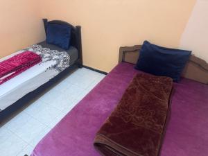 Postel nebo postele na pokoji v ubytování الامان والهدوء
