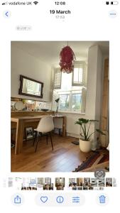 a living room with a desk and a table with a chair at 600sf 1 bedroom apartment in Moffat