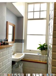 a bathroom with a sink and a window at 600sf 1 bedroom apartment in Moffat