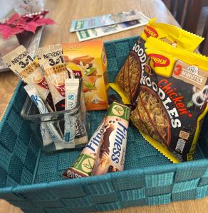 a basket filled with chips and snacks on a table at Vista del Mare Rooms 2 in Agios Ioannis Kaspaka +14 photos