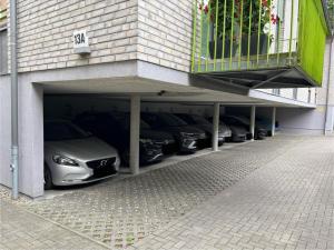 a row of cars parked in a garage at Über den Dächern von Kiel in bester Innenstadtlage in Kiel