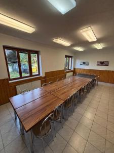 a large conference room with a long table and chairs at Rekreačko Hrubá Strana in Dolní Bzince