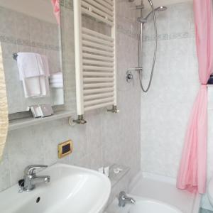 a bathroom with a sink and a shower at Hotel Ideale in Varazze