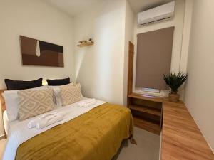 Ένα ή περισσότερα κρεβάτια σε δωμάτιο στο A2 Tsimiski