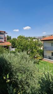 a view of a yard with trees and a house at Mery Inn in Pamukkale