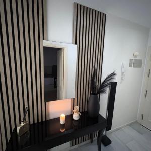 a room with a table with a candle and a mirror at Marbella urbanización privada in Marbella +8 photos