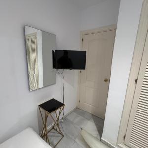 a room with a flat screen tv on a wall at Marbella urbanización privada in Marbella