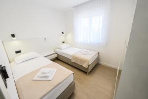 Postel nebo postele na pokoji v ubytování Maestral