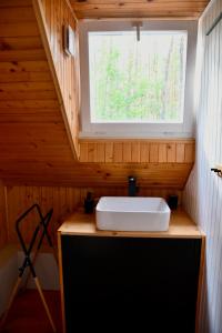 a bathroom with a sink and a window at Daleko od Szosy in Krajęczyn +49 photos