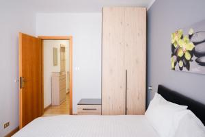 Postel nebo postele na pokoji v ubytování Residenza Garibaldi