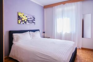 Postel nebo postele na pokoji v ubytování Residenza Garibaldi