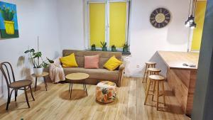 a living room with a couch and a table at Na Chopina in Krapkowice