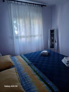 Postel nebo postele na pokoji v ubytování Tedi