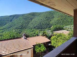 a view of a mountain from a house at La Fattoria Di Mamma Ro' in Narni